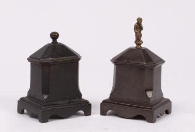 Two Regency cast iron tobacco boxes,