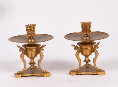 A pair of Regency style gilt metal candlesticks,