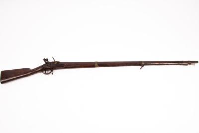 A flintlock rifle, the side plate