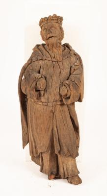 A wooden carved figure of a king, approximately