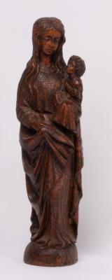 A carved wooden figure of a mother