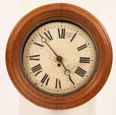 A circular oak eight-day wall clock,