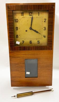 A 1930s walnut wall clock, fitted