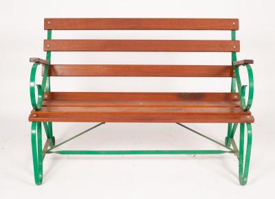 A slatted garden seat with wrought 36aff6