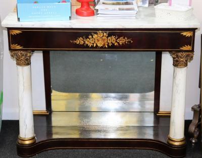 A marble topped console table, on marble