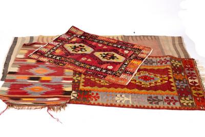 Four kelim rugs, the largest 218cm