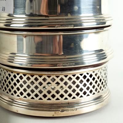 A pair of modern silver wine coasters