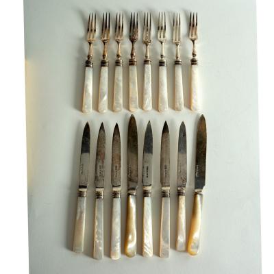 Eight pairs of silver dessert knives