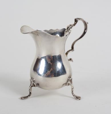 A silver helmet-shaped cream jug, JBC