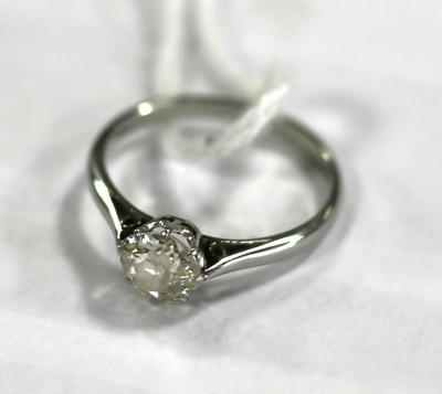 A diamond solitaire ring, the cushion
