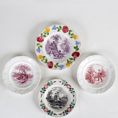 Four printed and painted nursery plates,