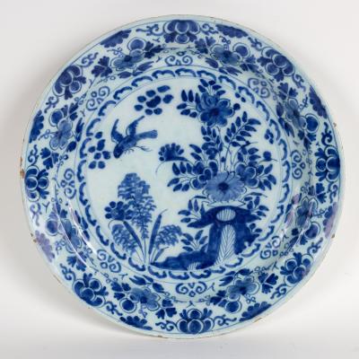 A Dutch delft blue and white plate decorated