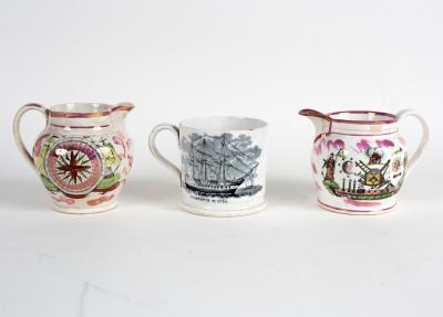 Two pink lustre jugs, one with
