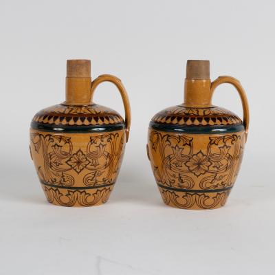 A pair of stoneware flagons with