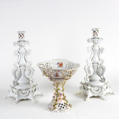 A pair of German porcelain candlesticks,