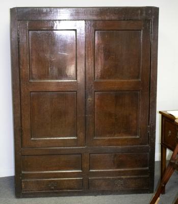 An 18th Century oak wardrobe, enclosed