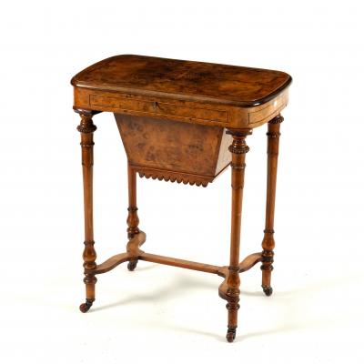 A Victorian walnut work table with 36d9e5