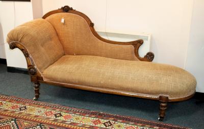 A Victorian carved walnut framed chaise