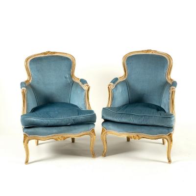 A pair of armchairs with painted moulded