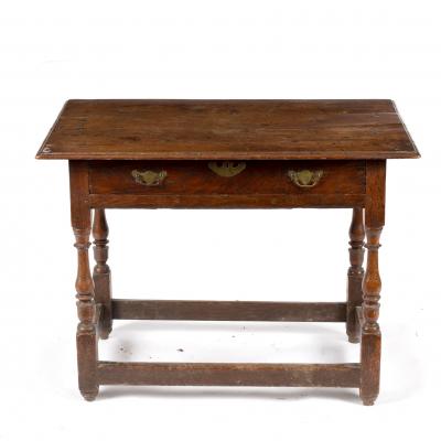 A late 17th Century oak table, fitted