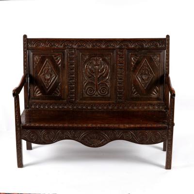 A 17th Century style oak bench,