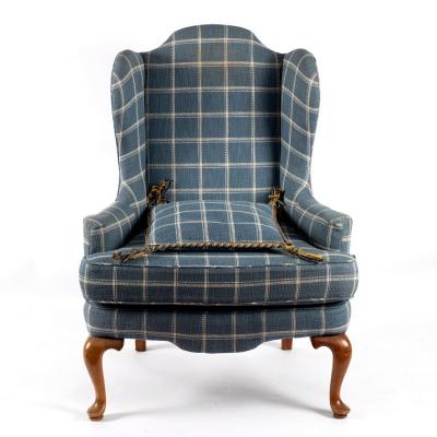 An 18th Century style wing armchair