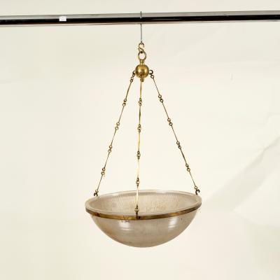 A glass ceiling shade suspended from