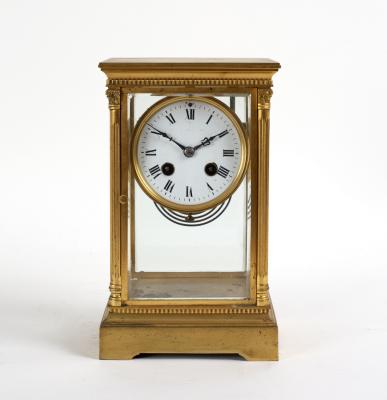 A gilt brass cased four glass clock  36da74