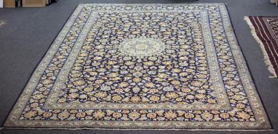 A Kashan carpet, the central pale