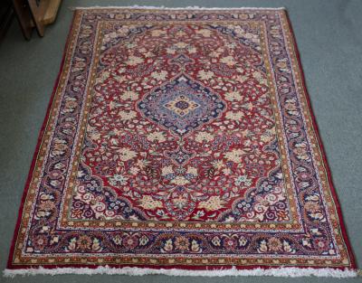 A Kashan rug, the central medallion
