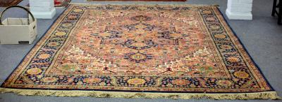 A Heriz style machine woven carpet,