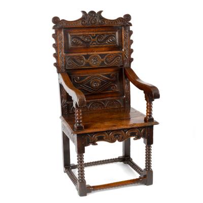 A Charles II oak open armchair,