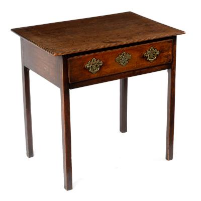 A George III oak table fitted a