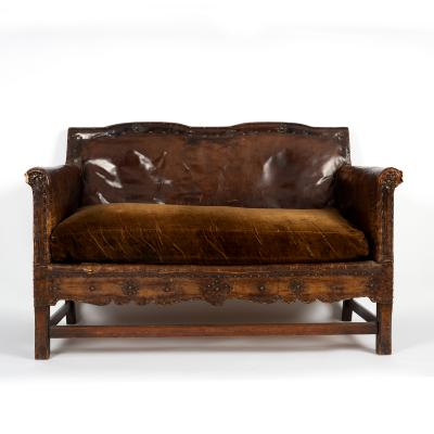 A leather sofa and two matching