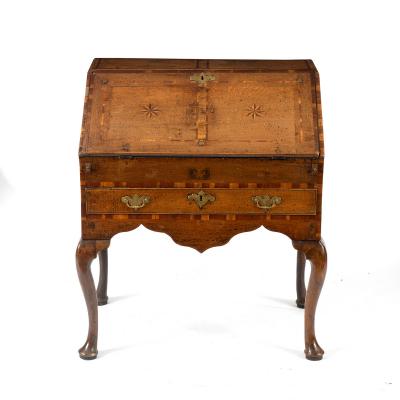 A George III provincial oak bureau,