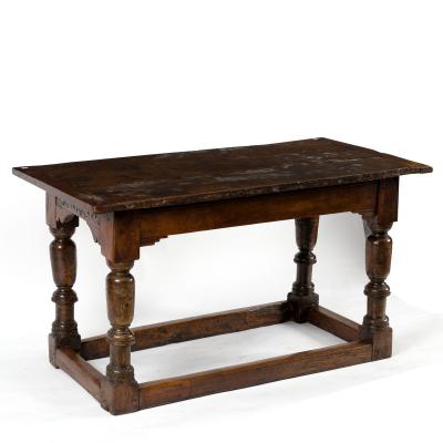 An oak table with associated triple