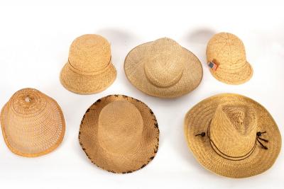 A topee type hat and five other straw
