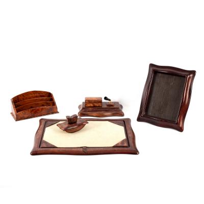A leather desk set of five pieces