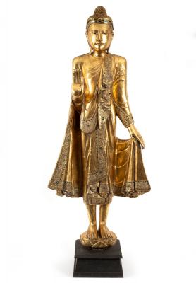 A standing figure of Buddha gilded and