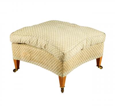 An upholstered stool by Howard