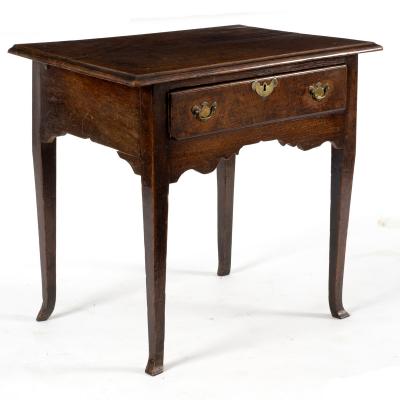 A George III oak table with drawer,