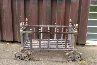 A basket grate with turned finials and