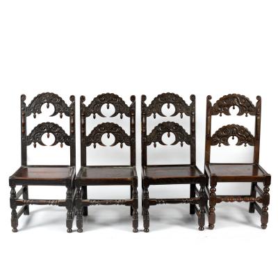 Four oak dining chairs with serrated