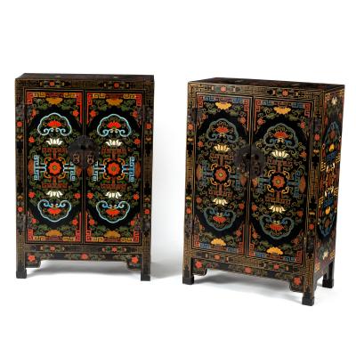 A pair of Chinese black lacquer cupboards
