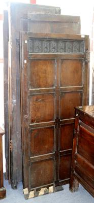An oak two-door wardrobe, with carved