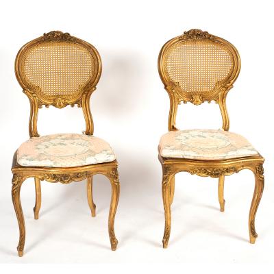 A pair of Louis XVI gilded chairs