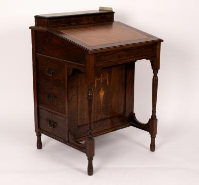 An Edwardian rosewood and inlaid Davenport,