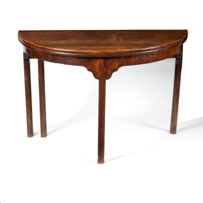 An early 19th Century half-round oak