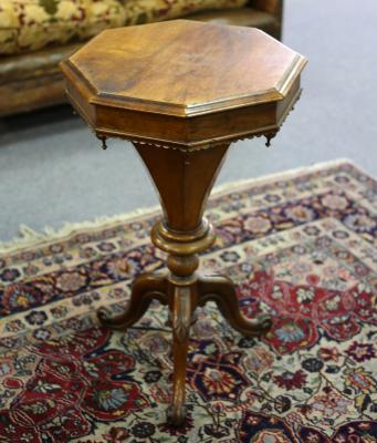 A Victorian walnut work table on