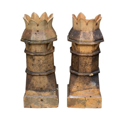 A pair of crown top chimney pots,